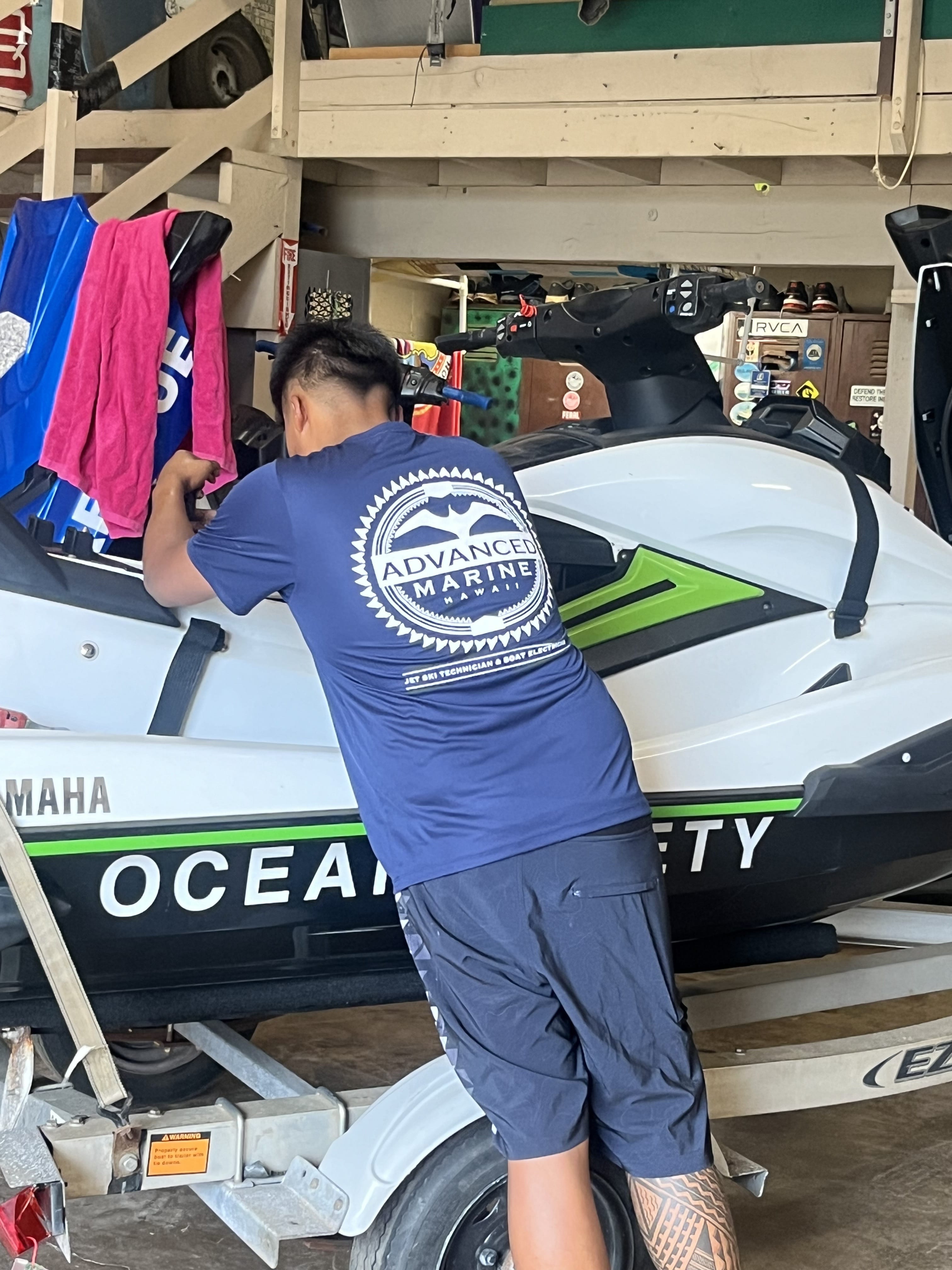 Technician working on jet ski